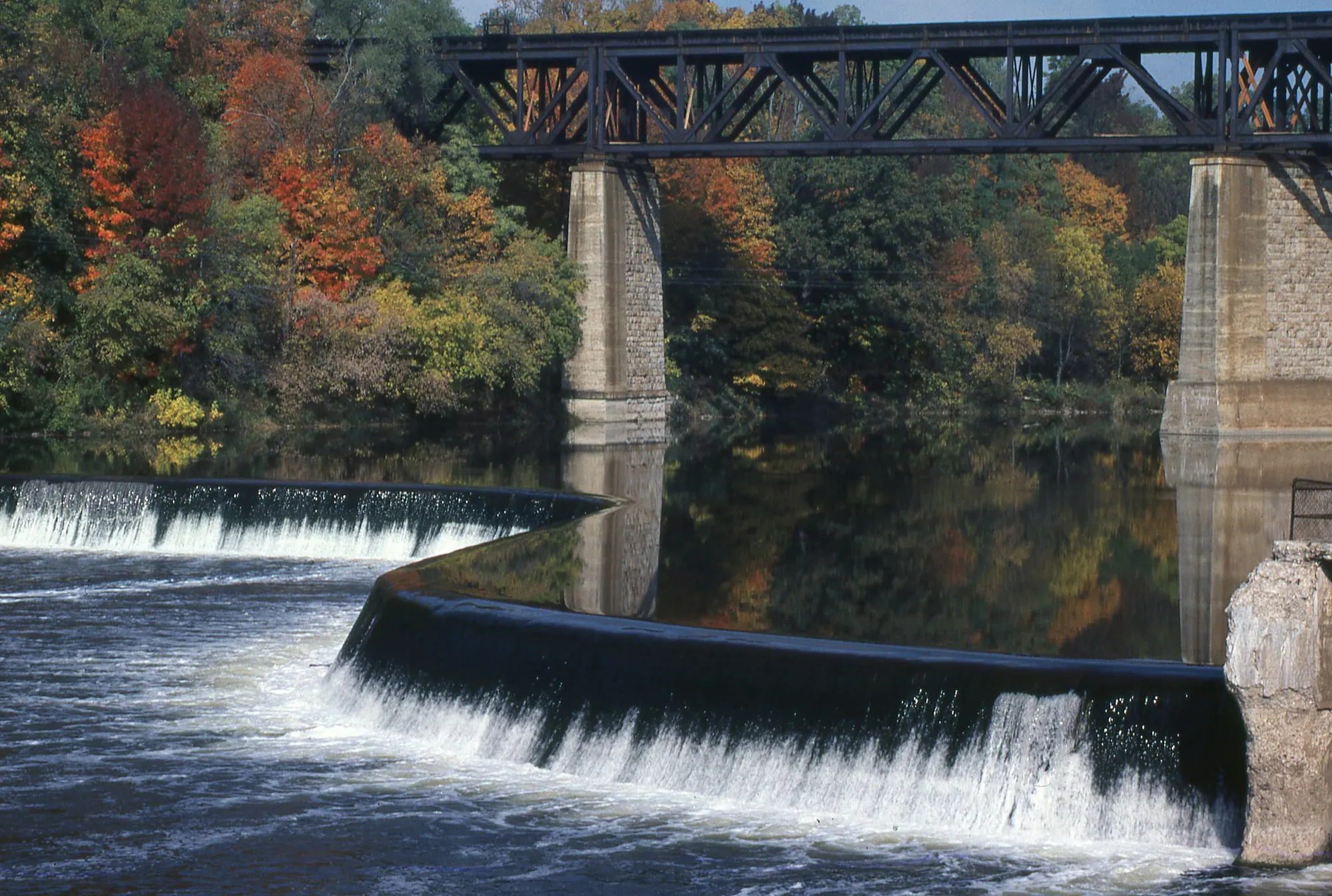 The Grand River and its railway bridge at Paris, Ontario, upstream of Brantford, in autumn
